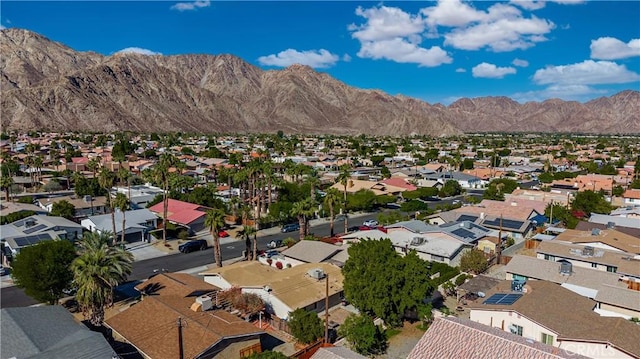 birds eye view of property featuring a mountain view