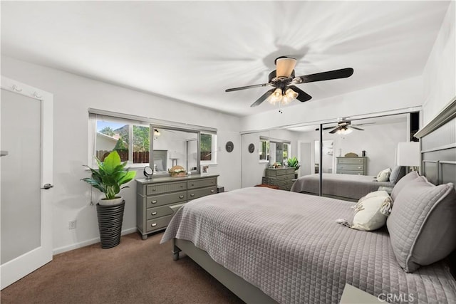 bedroom featuring ceiling fan and dark colored carpet