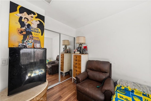 living area with hardwood / wood-style floors