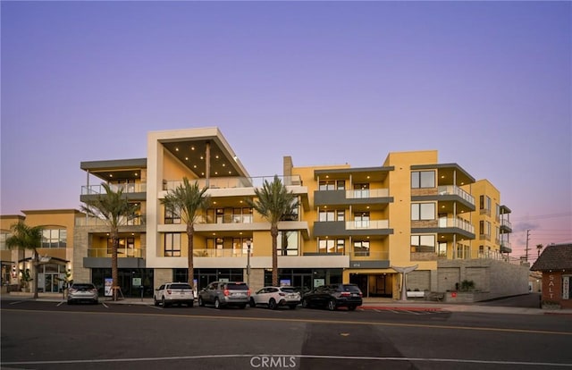 view of outdoor building at dusk