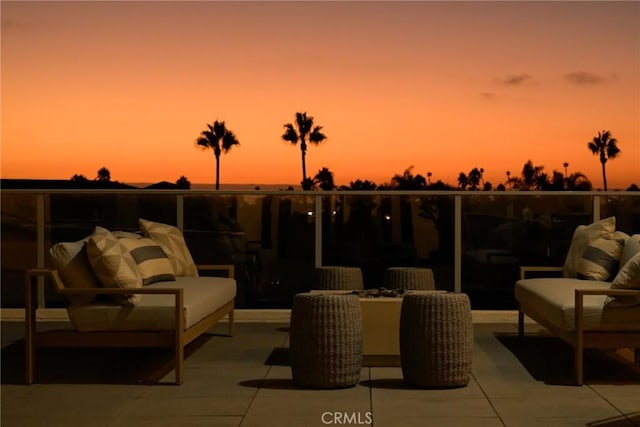 view of patio terrace at dusk