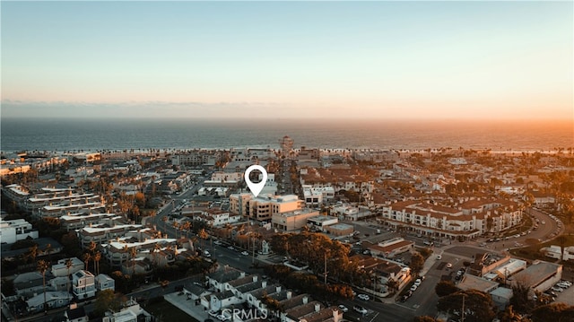 aerial view at dusk with a water view