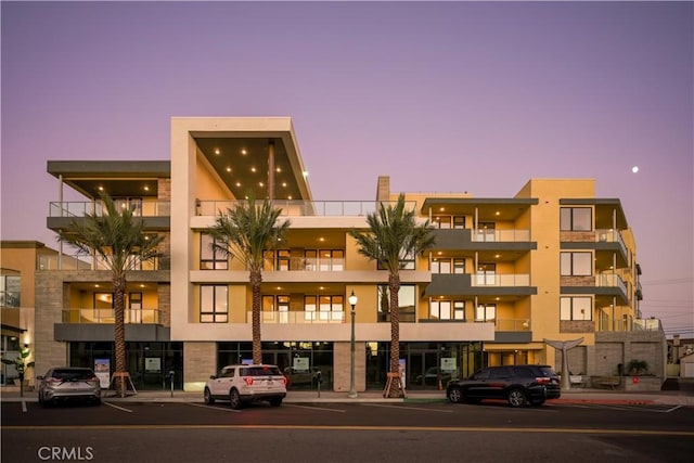 view of outdoor building at dusk