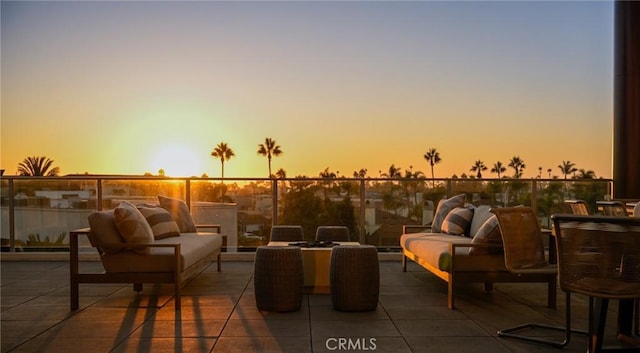 patio terrace at dusk with an outdoor living space