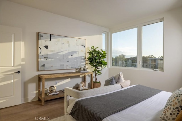 bedroom with hardwood / wood-style flooring