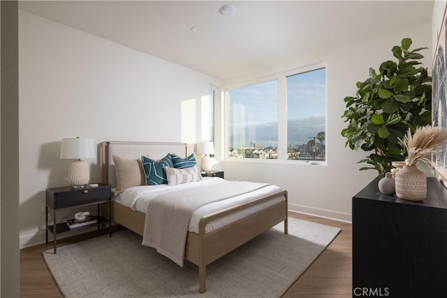 bedroom with hardwood / wood-style floors