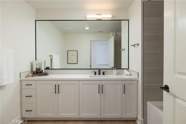 bathroom with shower / bathing tub combination, vanity, and hardwood / wood-style flooring