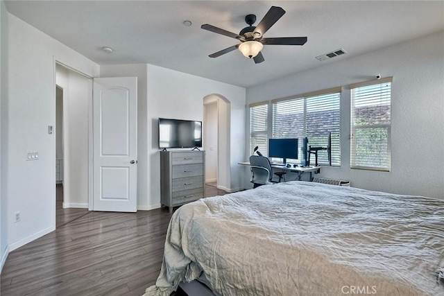 bedroom with dark wood-type flooring and ceiling fan