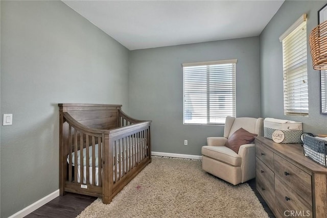 bedroom featuring a crib