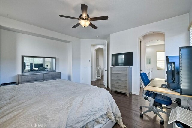 bedroom with dark hardwood / wood-style floors and ceiling fan