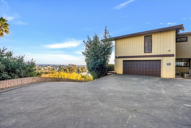 view of side of property with a garage