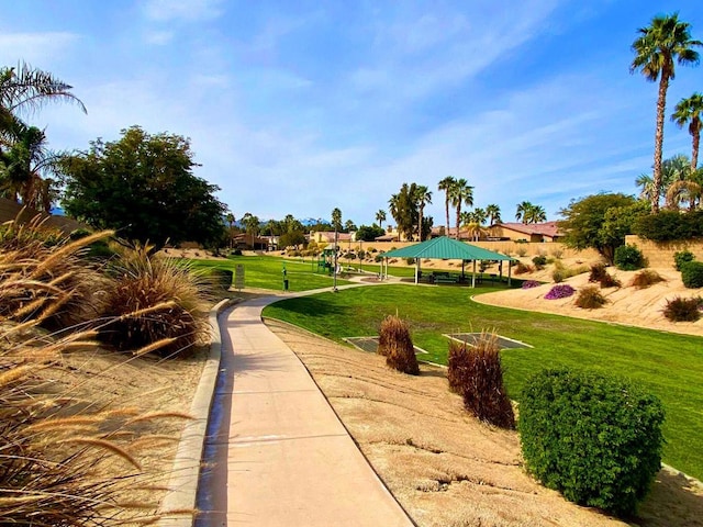 surrounding community featuring a gazebo and a lawn