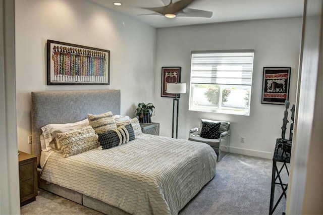 bedroom with ceiling fan and light colored carpet