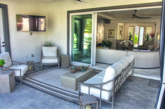 view of patio featuring ceiling fan and an outdoor hangout area