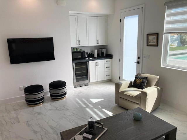 living room featuring beverage cooler and bar area