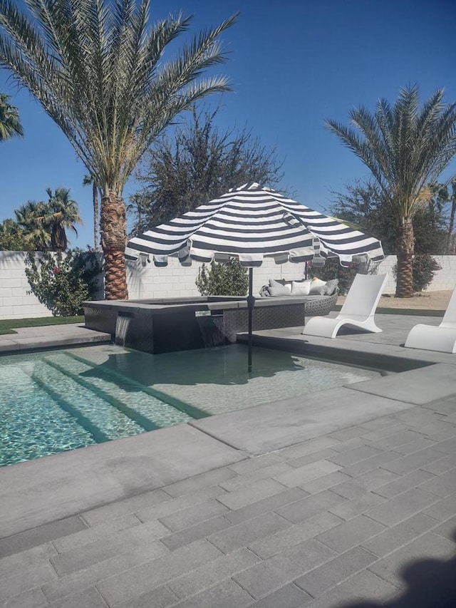 view of swimming pool featuring an outdoor living space and a patio area