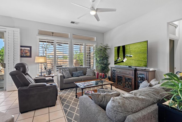 tiled living room featuring ceiling fan