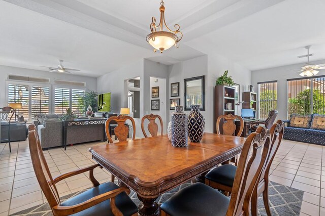 dining area with ceiling fan and light tile patterned floors