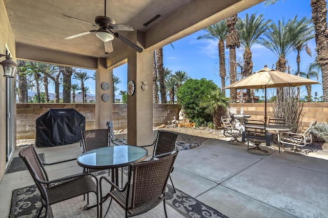 view of patio / terrace with ceiling fan and a grill