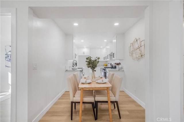 dining area with light wood-type flooring