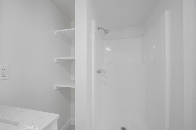 bathroom featuring walk in shower