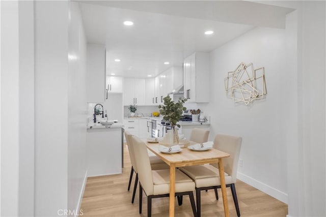 dining area with light wood-type flooring