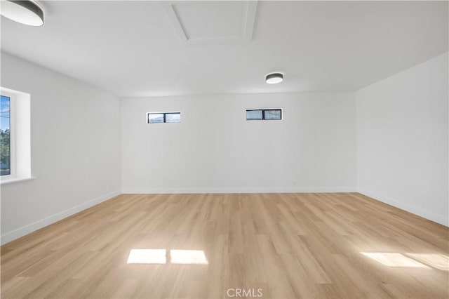 unfurnished room featuring light hardwood / wood-style flooring and a wealth of natural light