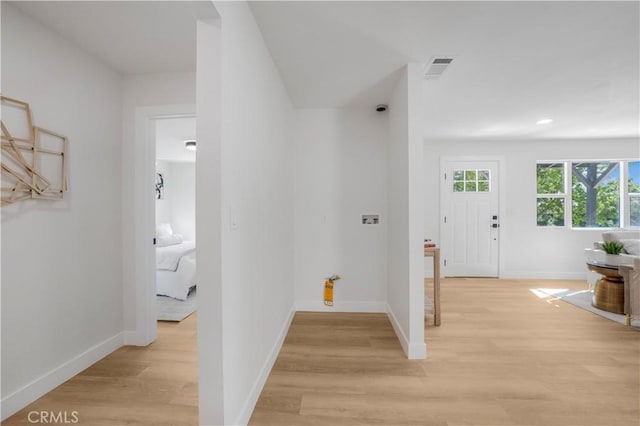 hallway featuring light hardwood / wood-style flooring