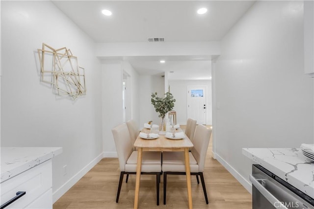 dining space featuring light hardwood / wood-style flooring