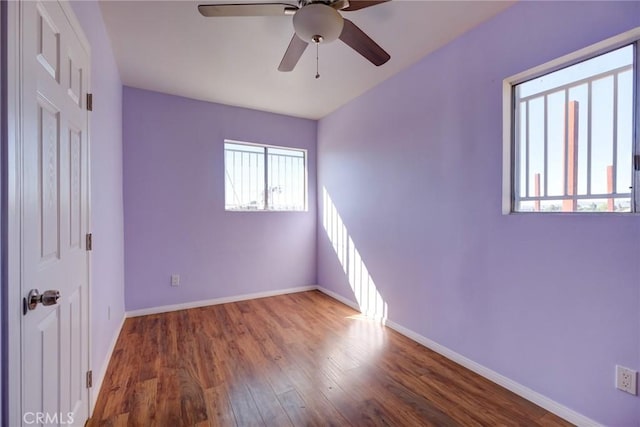 unfurnished bedroom featuring dark hardwood / wood-style floors and ceiling fan