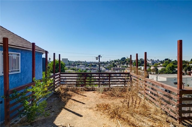 view of yard with a balcony