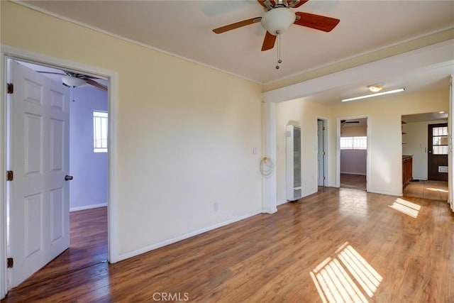 spare room with hardwood / wood-style flooring and ceiling fan