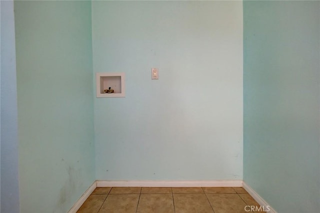 laundry room with hookup for a washing machine and light tile patterned floors