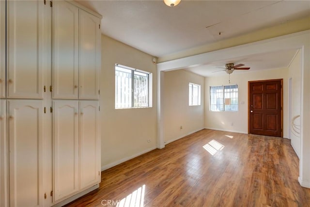 interior space with ceiling fan, a healthy amount of sunlight, and light hardwood / wood-style floors