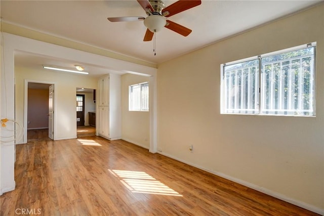 unfurnished room with ceiling fan and light hardwood / wood-style flooring