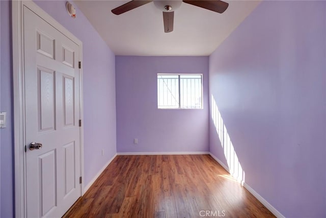 unfurnished bedroom with hardwood / wood-style floors and ceiling fan