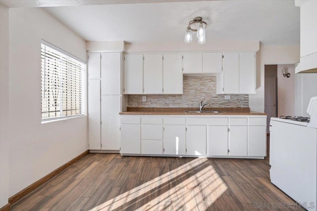 kitchen with white cabinetry, white range with gas cooktop, dark wood-type flooring, and sink