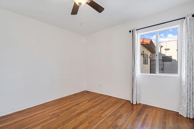 unfurnished room featuring ceiling fan and wood-type flooring