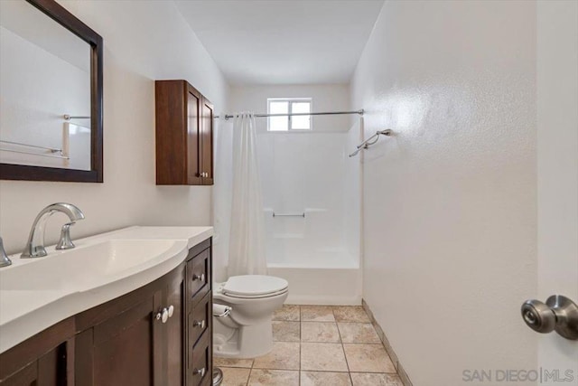 full bathroom featuring tile patterned flooring, shower / bath combo, toilet, and vanity