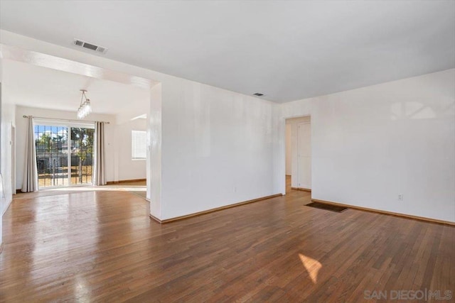 spare room featuring hardwood / wood-style floors