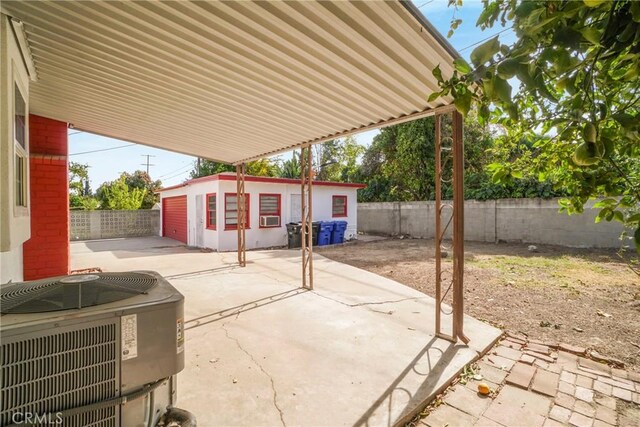 view of patio / terrace with an outdoor structure and central air condition unit