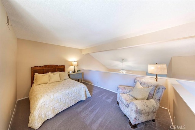 bedroom featuring vaulted ceiling with beams, ceiling fan, and dark colored carpet