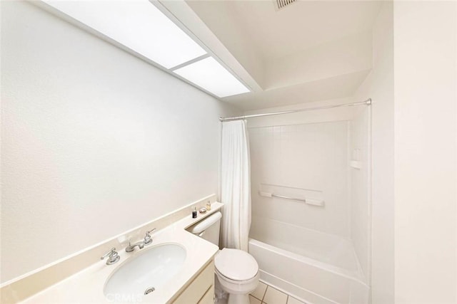 full bathroom featuring tile patterned floors, vanity, toilet, and shower / tub combo