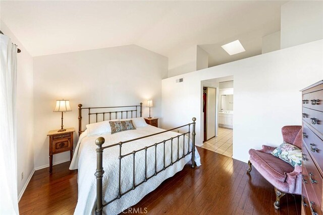 27551 Paseo Tamara, San Juan Capistrano, CA 92675 - bedroom featuring hardwood / wood-style flooring, a skylight, ensuite bathroom, and high vaulted ceiling