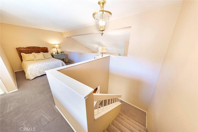 bedroom with lofted ceiling and carpet floors