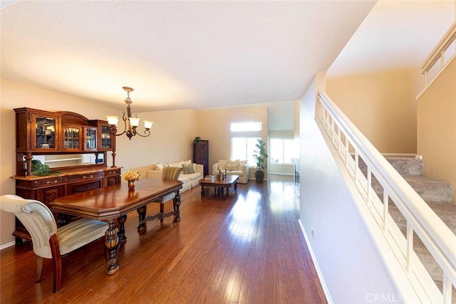 dining room featuring a notable chandelier and dark hardwood / wood-style floors