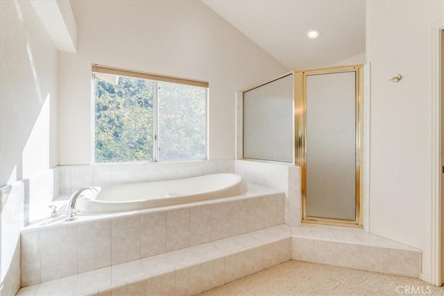 bathroom featuring an enclosed shower and lofted ceiling