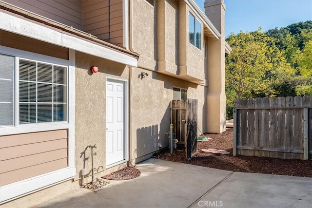 property entrance with a patio area