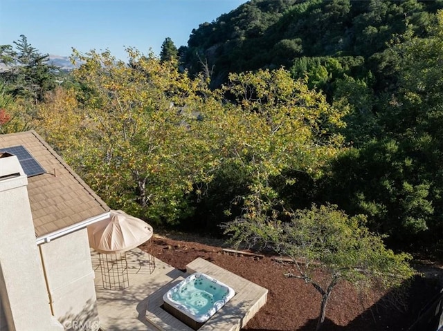 view of patio with an outdoor hot tub