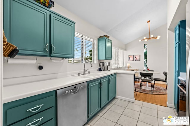 kitchen with sink, stainless steel dishwasher, decorative light fixtures, vaulted ceiling, and light tile patterned flooring